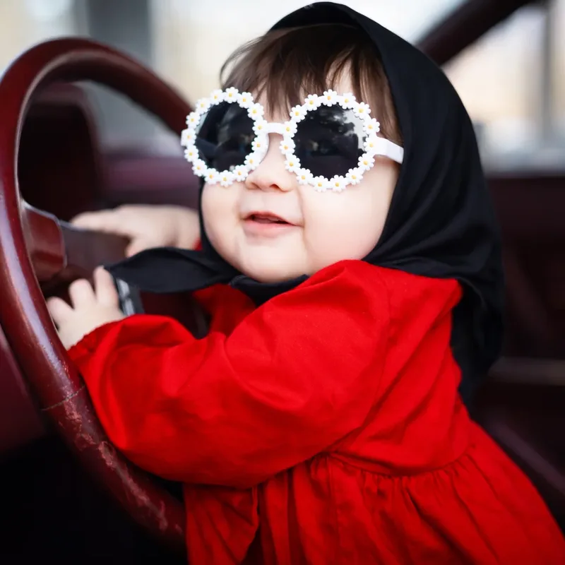 Toddler in sunglasses full of personality